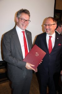 Polish Ambassodor Dr Arkady Rzegocki presents Dermot Turing with a letter from the President of the Republic of Poland Andrzej Duda